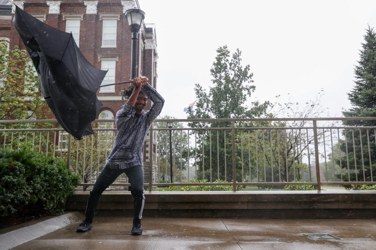 A student holds onto his umbrella during Category 4 Hurricane Helene on Friday, Sept. 27, 2024, at the University of Kentucky in Lexington, Kentucky. Photo by Abbey Cutrer | Staff