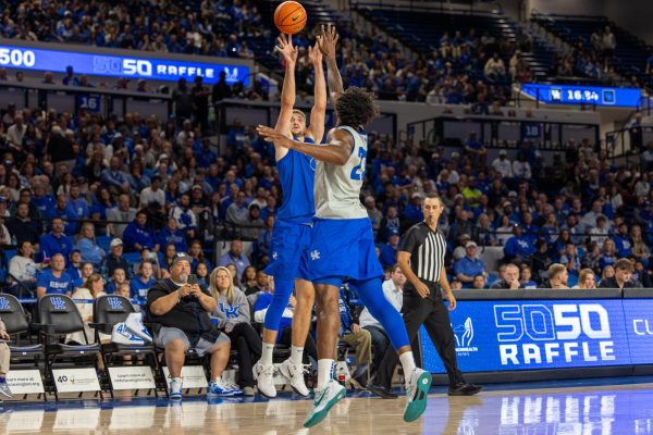 Kentucky forward Andrew Carr (7) shoots a three during the Kentucky Blue-White Preseason Event on Friday, Oct. 18, 2024, at Historic Memorial Coliseum in Lexington, Kentucky. Photo by Sydney Yonker | Staff