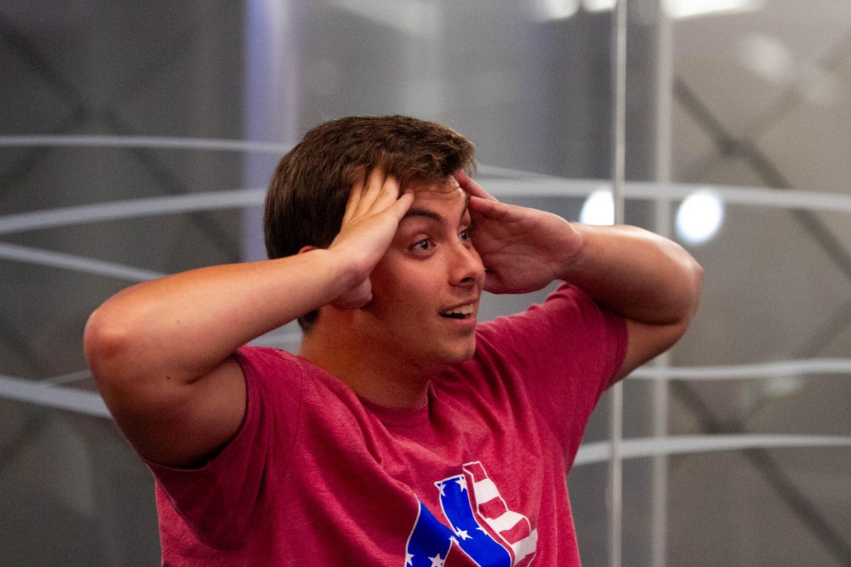 Blake Eggleston, a freshman political science major, reacts to one of Gov. Tim Walz’s points during the vice presidential debate Turning Point watch party on Tuesday, Oct. 1, 2024, at the Gatton Student Center in Lexington, Kentucky. Photo by Christian Kantosky | Staff