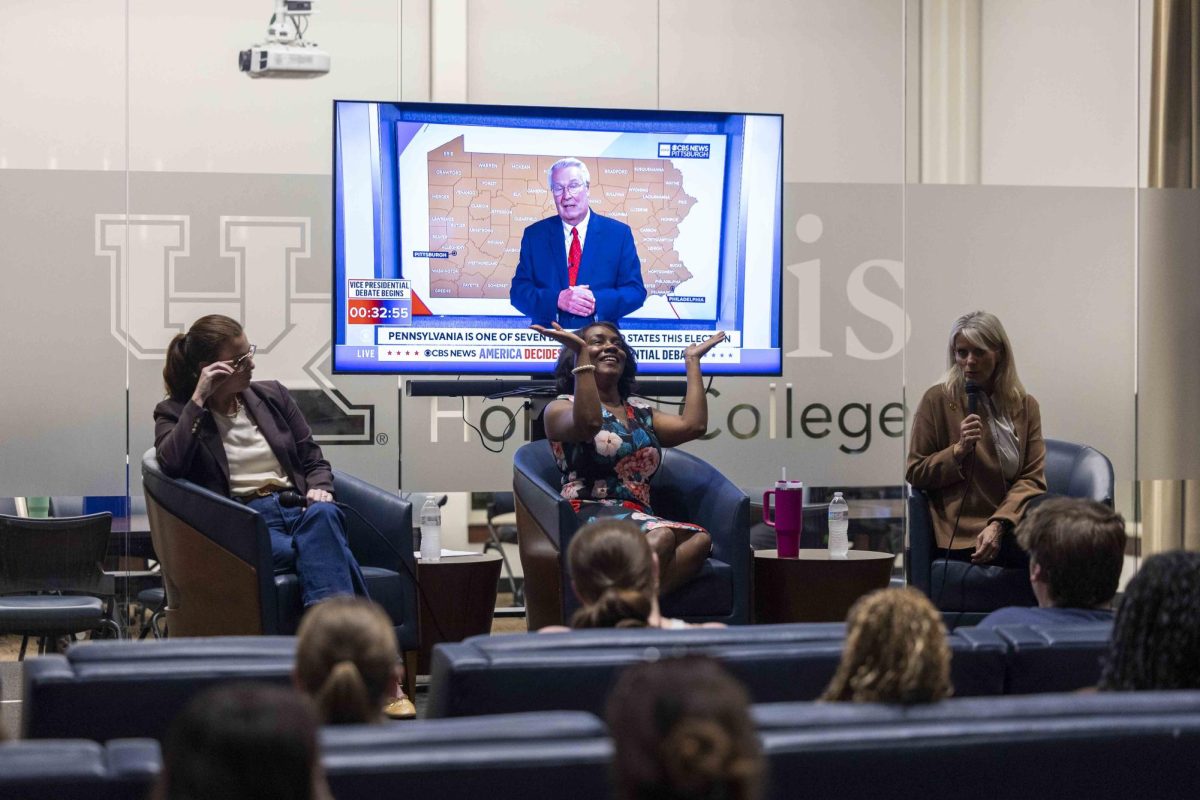 Democratic Party Chair Morgan Eaves and Republican Committeewoman KC Crosbie debate during the pre-debate Q&A on Tuesday, Oct. 1, 2024, at Lewis Honors College in Lexington, Kentucky. Photo by Matthew Mueller | Staff 