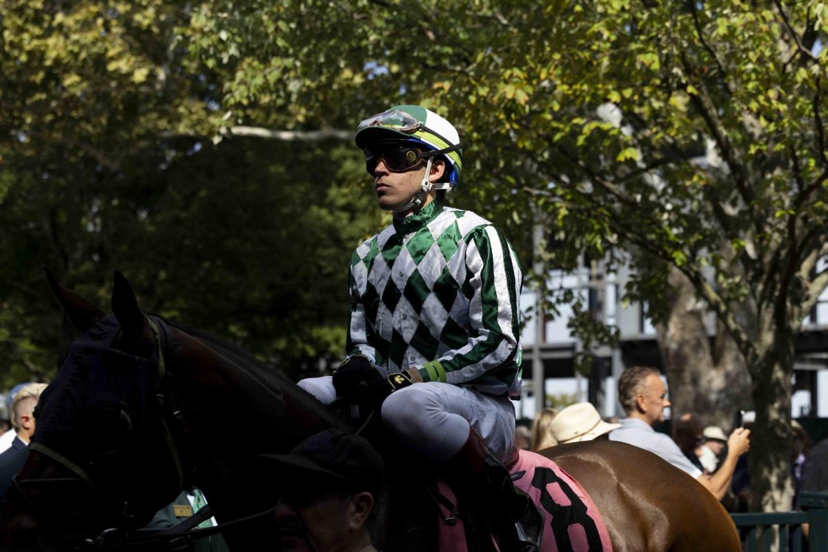 A jockey rides his horse onto the track during the opening day of the Fall Meet on Friday, Oct. 4, 2024, at Keeneland in Lexington, Kentucky. Photo by Matthew Mueller | Staff 