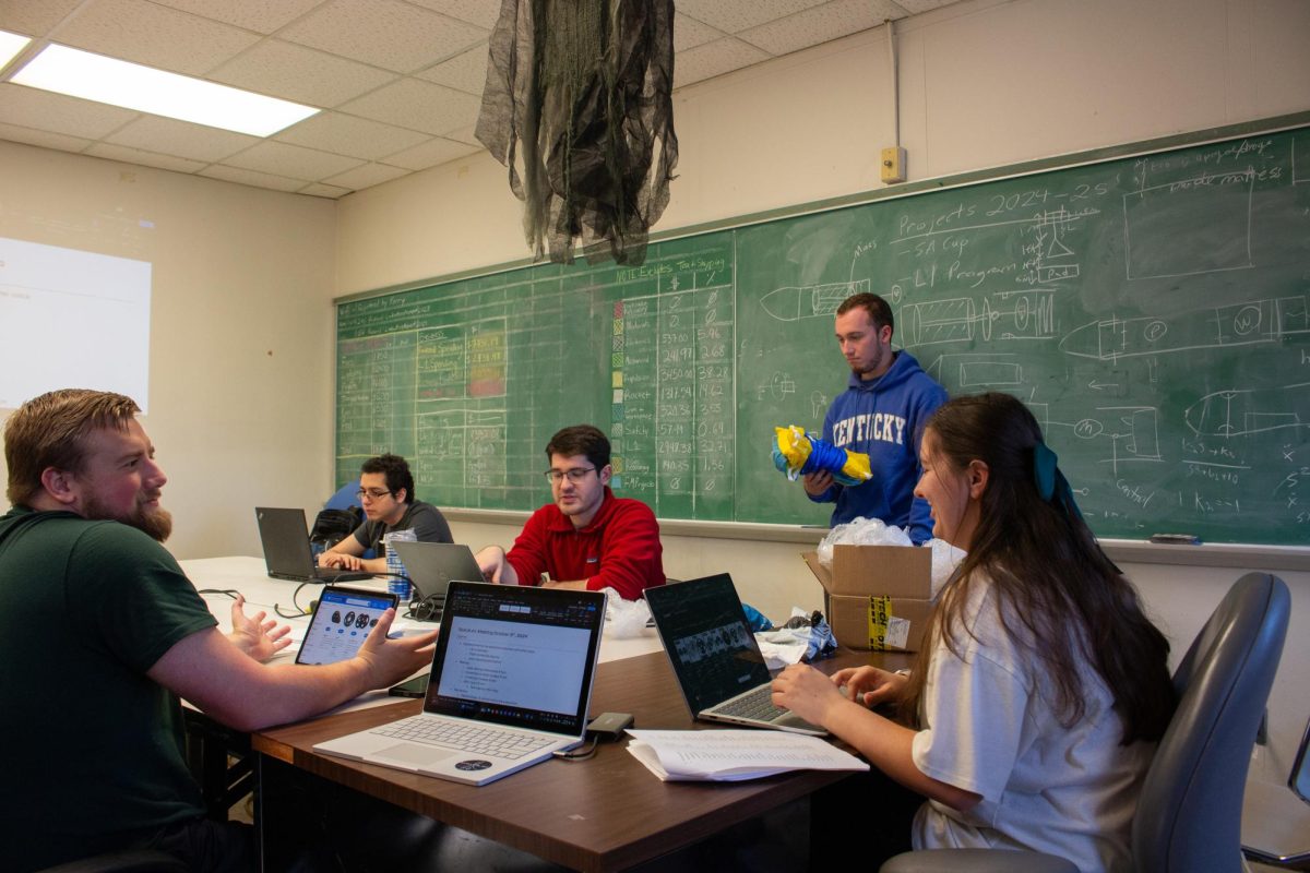 Space Lex leaders Lucas Stevenson, Rayan Pasha, Christian Lauritzen, Perry Calvert, and Tatum St. Clair discuss measurements during the Space Lex meeting on Wednesday, Oct. 9, 2024, at the Terrell Civil Engineering building in Lexington, Kentucky. Photo by Michael Henning | Staff