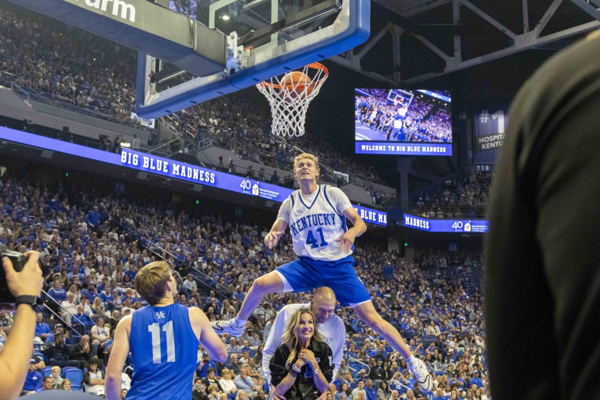 Kentucky guard Collin Chandler dunks the ball over head coach Mark Pope during Big Blue Madness on Friday, Oct. 11, 2024, at Rupp Arena in Lexington, Kentucky. Photo by Matthew Mueller | Staff