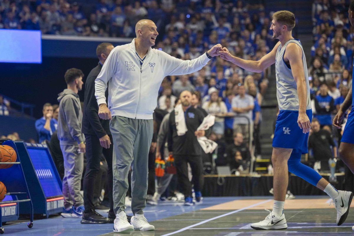 Kentucky Mens Basketball head coach Mark Pope fist bumps forward Andrew Carr during Big Blue Madness on Friday, Oct. 11, 2024, at Rupp Arena in Lexington, Kentucky. Photo by Matthew Mueller | Staff