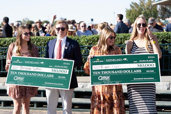 Christina Sutton and Ryan Lewis (each end) pose with their checks after winning the $10,000 scholarship prizes at Keeneland College Scholarship Day on Friday, Oct. 18, 2024, at Keeneland in Lexington, Kentucky. Photo by Christian Kantosky | Staff