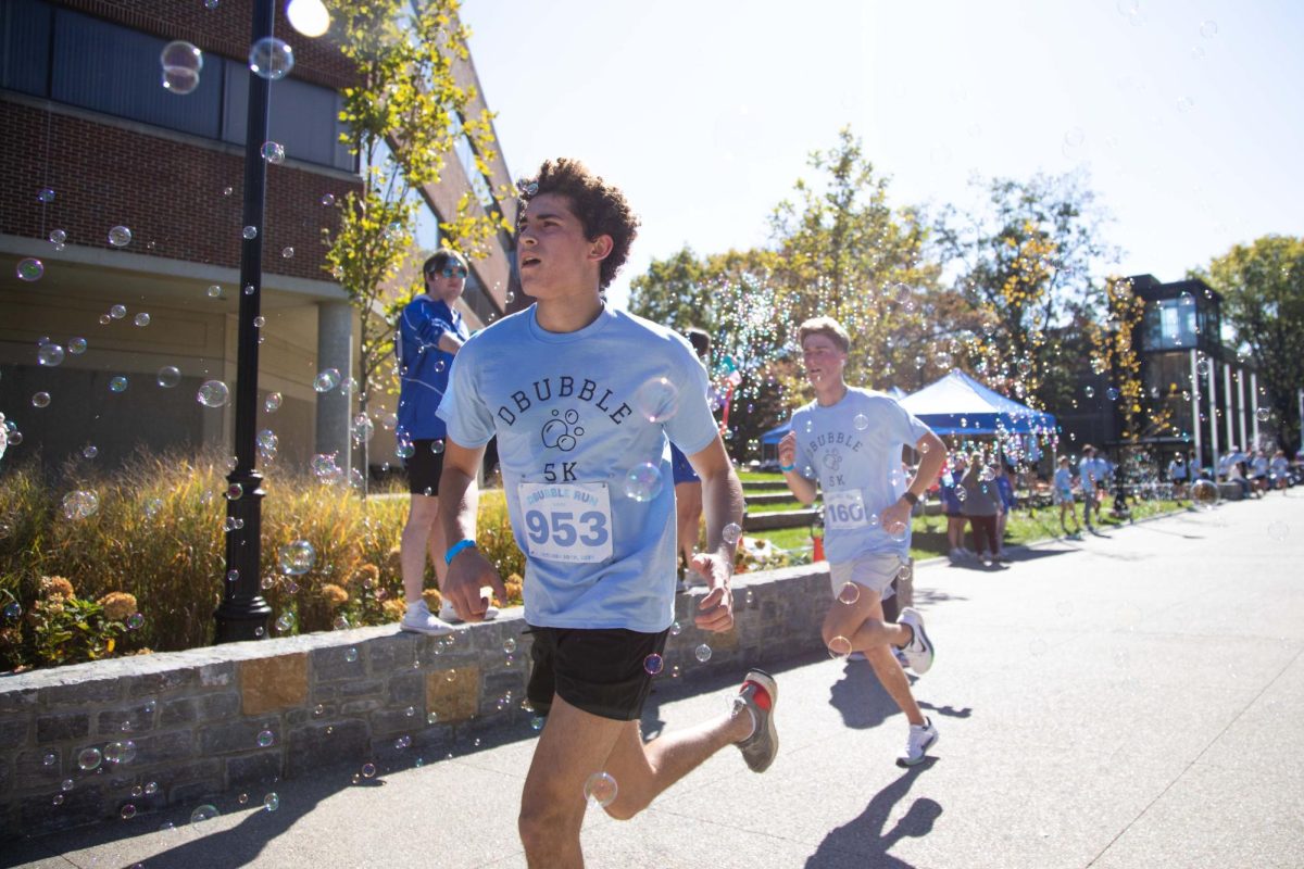 Students race toward the finish line of the Dance Blue 5K bubble run on Sunday, Oct. 20, 2024, at Alumni Commons in Lexington, Kentucky. Photo by Christian Kantosky | Staff