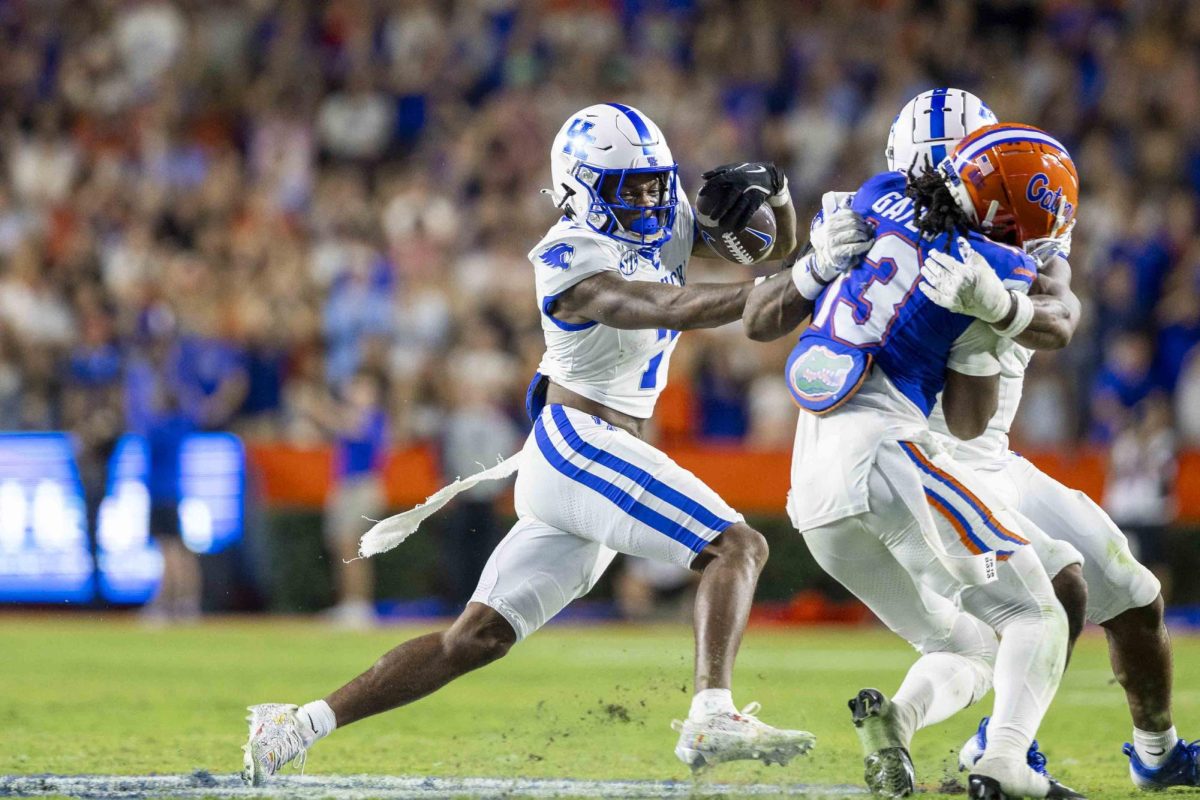 Kentucky Wildcats wide receiver Barion Brown (7) tries to avoid defenders during the football game vs. Florida on Saturday, Oct. 19, 2024, at Ben Hill Griffin Stadium in Gainesville, Florida. Kentucky lost 48-20. Photo by Matthew Mueller | Staff