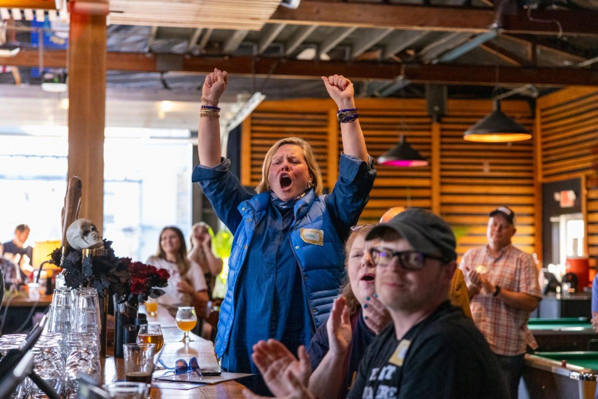 Alisha Chaffin, 54, cheers during the rally To Get Out the Vote on Wednesday, Oct. 30, 2024, at Burl Brew in Lexington, Kentucky. Photo by Sydney Yonker | Staff