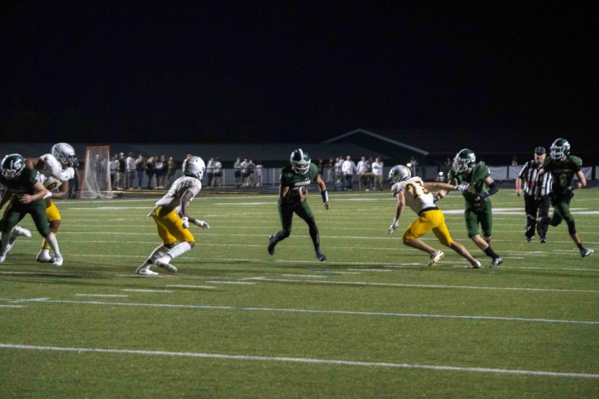 A South Oldham football player runs the football during the South Oldham High School vs. Woodford County High School football game on Friday, Oct. 4, 2024, at Mitchell Irvin Stadium in Crestwood, Ky. Photo by Cole Parke | Staff