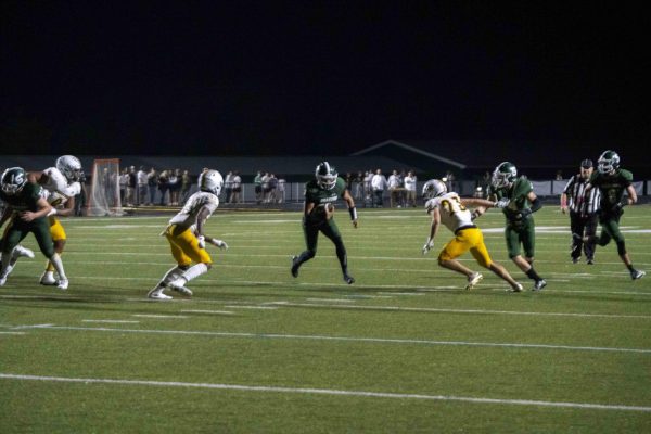 A South Oldham football player runs the football during the South Oldham High School vs. Woodford County High School football game on Friday, Oct. 4, 2024, at Mitchell Irvin Stadium in Crestwood, Ky. Photo by Cole Parke | Staff