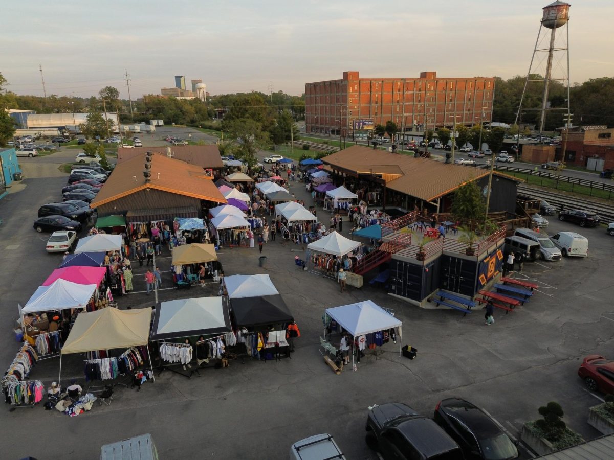 People gather to shop and buy clothes during The Drunken Flea Market at The Burl Brewery in Lexington, Kentucky, on October 12, 2024. Photo by Michael Henning | Staff