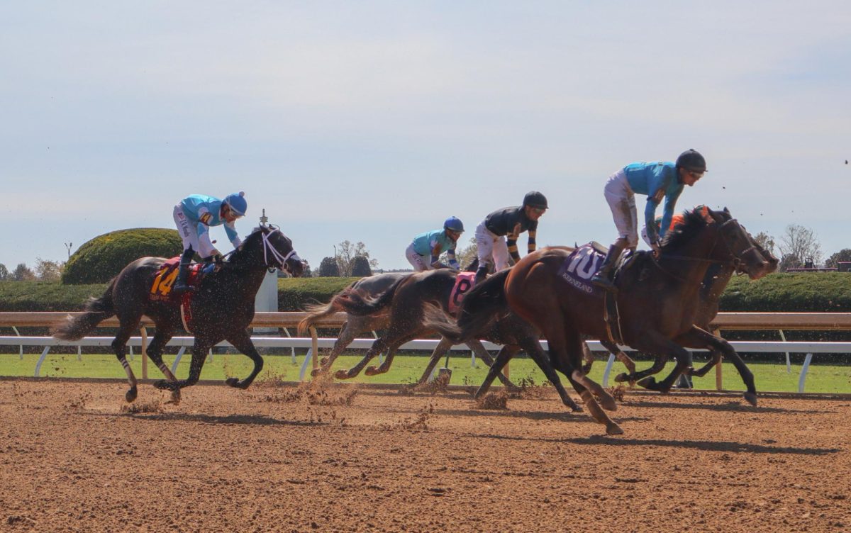 Horses pass the finish line during Keeneland College Scholarship Day on Friday, Oct. 18, 2024, at Keeneland in Lexington, Kentucky. Photo by Mateo Smith Villafranco | Staff