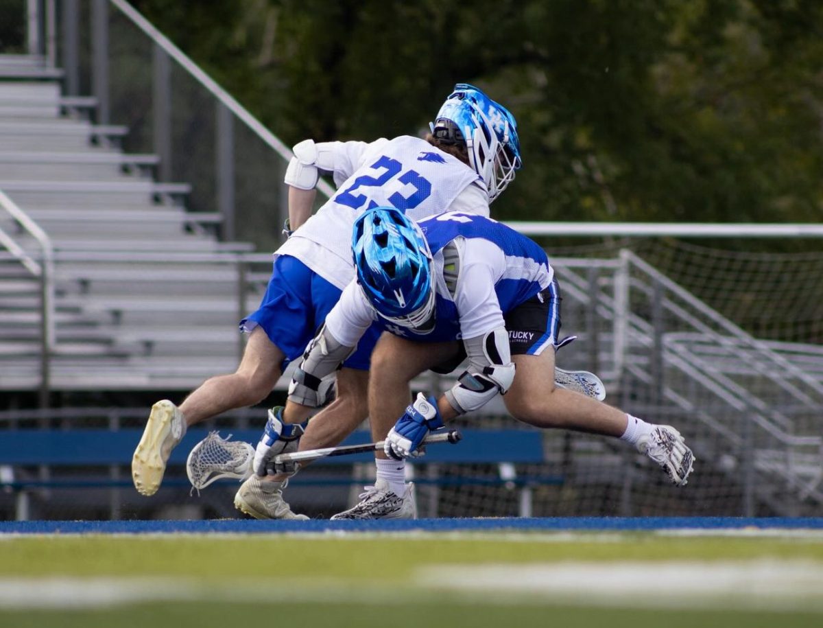 Two Kentucky men's club lacrosse players, including junior face-off specialist Clay Stambaugh (23), face off in a scrimmage. Photo provided by Kaleigh Sutton | Kentucky men's lacrosse