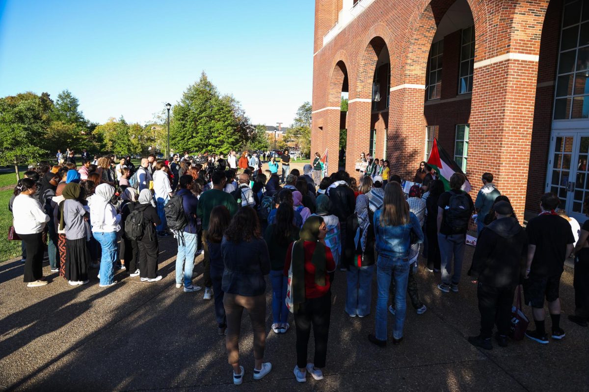 People gather at a vigil for the deaths in Palestine on Monday, Oct. 7, 2024, outside of the William T. Young Library in Lexington, Kentucky. Photo by Abbey Cutrer | Staff