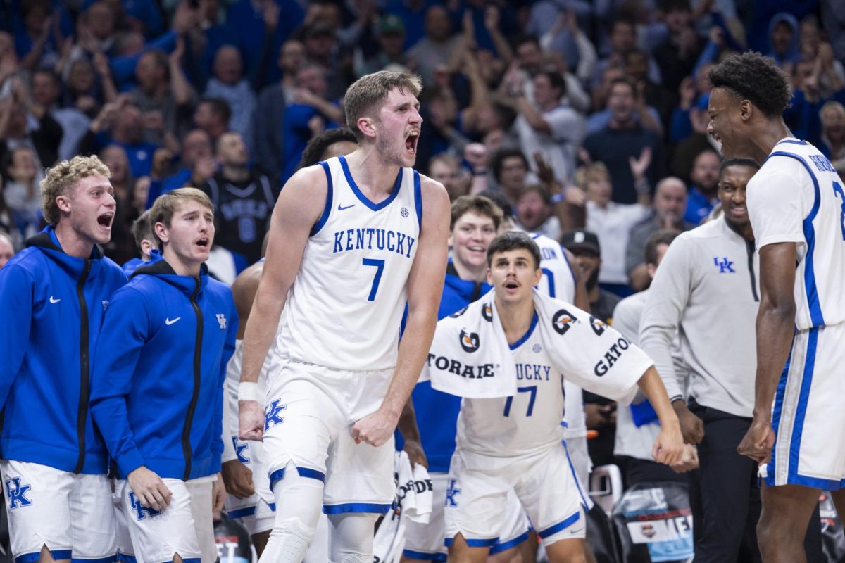 Kentucky Wildcats forward Andrew Carr (7) celebrates after making a and-one shot during the basketball game vs. Duke on Wednesday, Nov. 13, 2024, at State Farm Arena  in Atlanta , Georgia . Kentucky won 77-72 Photo by Matthew Mueller | Photo Editor 