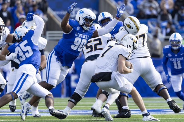 Kentucky Wildcats defensive lineman Tre'vonn Rybka (90) dives to sack Murray State Racers quarterback Jayden Johannsen (7) during the football game vs. Murray State Saturday, Nov. 16, 2024, at Kroger Field in Lexington, Kentucky. Photo by Matthew Mueller | Staff