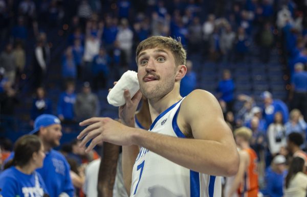 Kentucky forward Andrew Carr (7) throws a T-shirt into the crowd during the basketball game vs. Bucknell on Saturday, Nov. 9, 2024, at Rupp Arena  in Lexington, Kentucky. Kentucky won 100-72. Photo by Matthew Mueller | Staff