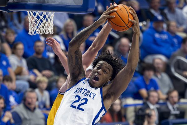 Kentucky Wildcats center Amari Williams (22) jumps into the air for a rebound during the basketball game vs. Lipscomb on  Tuesday, Nov. 19, 2024, at Rupp Arena in Lexington, Kentucky. Kentucky won 97-68. Photo by Matthew Mueller | Photo Editor