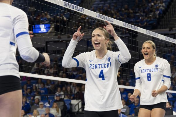 Setter Emma Grome (4) and Brooke Bultema (8) celebrate after Kentucky scored a point during the Volleyball match vs. Arkansas on Sunday, Nov. 24, 2024, at Historic Memorial Coliseum in Lexington, Kentucky. Kentucky won 3-0. Photo by Matthew Mueller | Photo Editor