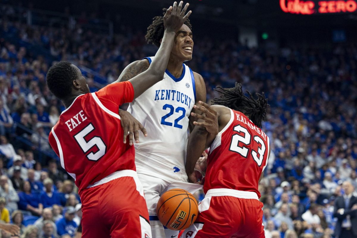 Kentucky Wildcats center Amari Williams (22) gets hit while trying to rebound the ball during the basketball game vs. WKU on Tuesday, Nov. 26, 2024, at Rupp Arena in Lexington, Kentucky. Kentucky won 87-68 Photo by Matthew Mueller | Photo Editor