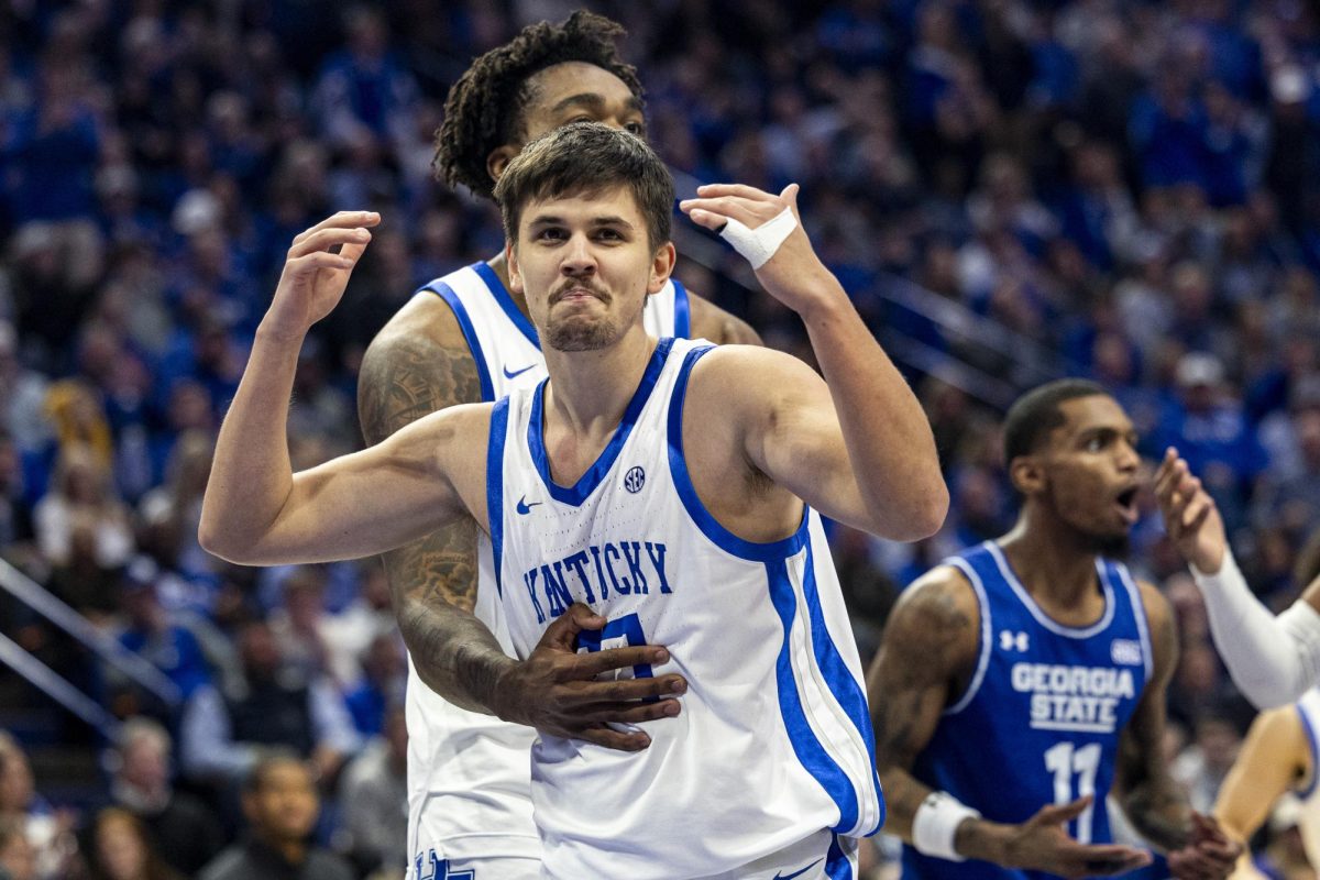 Kentucky Wildcats guard Kerr Kriisa (77) cheers the fans on after he drew a foul during the basketball game vs. Georgia State on Friday, Nov. 29, 2024, at Rupp Arena in Lexington, Kentucky. Kentucky won 105-76. Photo by Matthew Mueller | Photo Editor