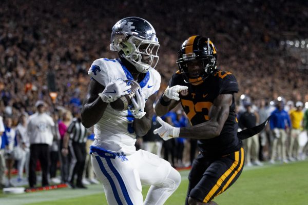 Kentucky Wildcats wide receiver Ja’Mori Maclin (9) catches the ball in the end zone to score a touchdown, while Tennessee defensive back Boo Carter (23) chases to stop him during the Kentucky vs. Tennessee football game on Saturday, Nov. 2, 2024, at Neyland Stadium in Knoxville, Tennessee. Kentucky lost 28-18. Photo by Christian Kantosky | Staff