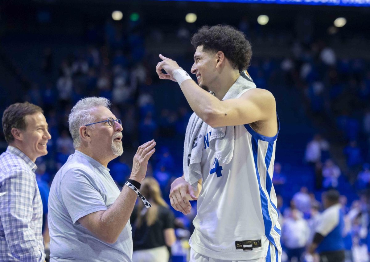 Kentucky Wildcats guard Koby Brea (4) laughs and high-fives fans after the basketball game vs. Wright State on Monday, Nov. 4, 2024, at Rupp Arena in Lexington, Kentucky. Kentucky won 103-62. Photo by Matthew Mueller | Staff