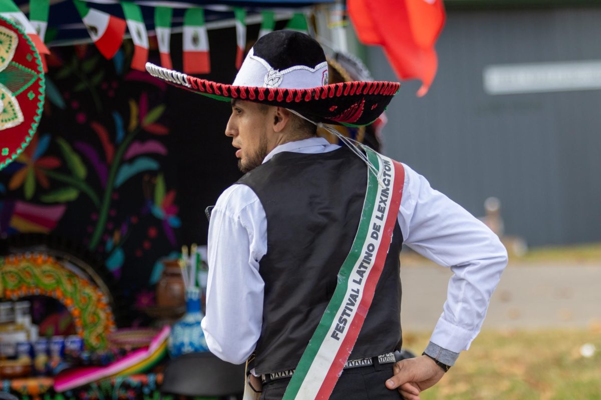 Vendor Ricardo Mendoza representing Mexico speaks on the phone on Saturday, Nov. 9, 2024, at the Festival Latino de Lexington in Lexington, Kentucky. Photo by Sydney Novack | Staff