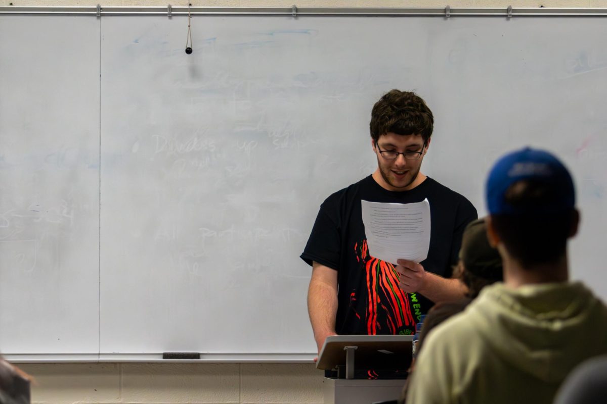 Josi Hofmeister, a freshman neuroscience major shares their pieces "Flowers" and "Sandcastle" to the crowd at Sigma Tau Delta's Live Literature event in Room 201 - Chem-Phys Building at the University of Kentucky in Lexington, Kentucky, on Wednesday, Nov. 13, 2024. Photo by Sydney Novack | Staff