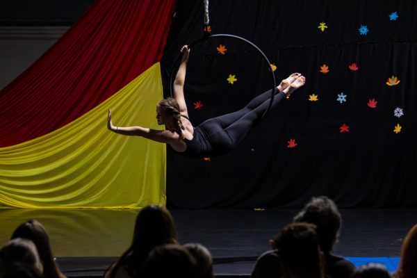 University of Kentucky student Liz Stuckenborg, performs “Wednesday” to the crowd at the Circus Cats Showcase event in Barker Hall at the University of Kentucky in Lexington, Kentucky, on Friday, Nov. 15, 2024. Photo by Sydney Novack | Staff