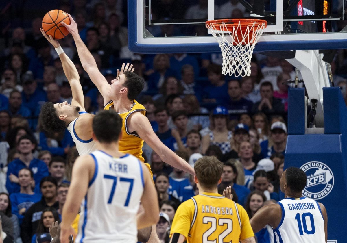 Lipscomb Bisons forward Dylan Faulkner (15) blocks Kentucky Wildcats guard Koby Brea (4) during the basketball game vs. Lipscomb on Tuesday, Nov. 19, 2024, at Rupp Arena in Lexington, Kentucky. Kentucky won 97-68. Photo by Christian Kantosky | Assistant Photo Editor