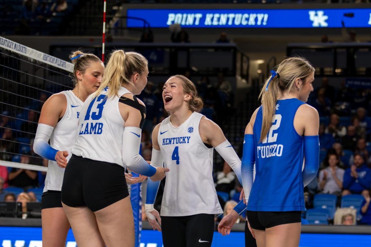 Kentucky Wildcats setter Emma Grove (4) celebrates with teammates after a point during the Kentucky vs. Mississippi State volleyball game on Wednesday, Nov. 20, 2024, at Historical Memorial Coliseum in Lexington, Kentucky. Kentucky won 3-0. Photo by Sydney Novack | Staff