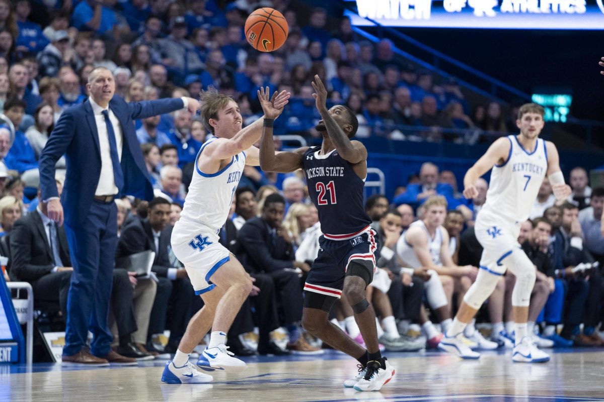 Kentucky Wildcats guard Travis Perry (11) has the ball stolen by Jackson State Tigers guard Marcus Watson Jr. (21) during the basketball game against Jackson State on Friday, Nov. 22, 2024, at Rupp Arena in Lexington, Kentucky. Kentucky won 108-59. Photo by Christian Kantosky | Assistant Photo Editor