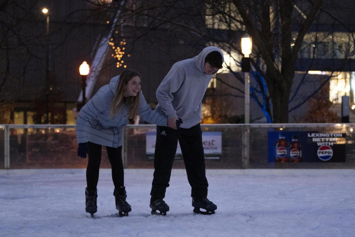 Members of Allansville Baptist Church skates around the rink on Saturday, Nov. 23, 2024, at the Triangle Park Ice Rink in Lexington, Kentucky. Photo by Christian Kantosky | Assistant Photo Editor