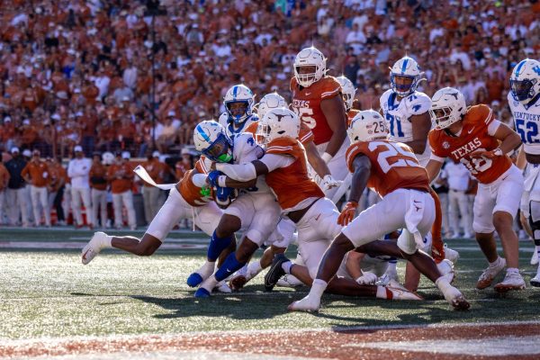 Kentucky Wildcats running back Demie Sumo-Karngbaye (0) fights through the Texas defense during the Kentucky vs. Texas football game Saturday, Nov. 23, 2024, at Darrell K Royal-Texas Memorial Stadium in Austin, Texas. Photo by Sydney Yonker | Staff