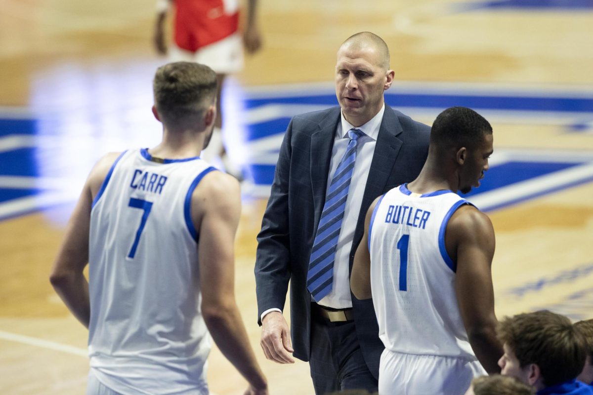 Kentucky Wildcats head coach Mark Pope talks with Andrew Carr (7) and Lamont Butler (1) during the basketball game vs. WKU on Tuesday, Nov. 26, 2024, at Rupp Arena in Lexington, Kentucky. Kentucky won 87-68. Photo by Christian Kantosky | Assistant Photo Editor