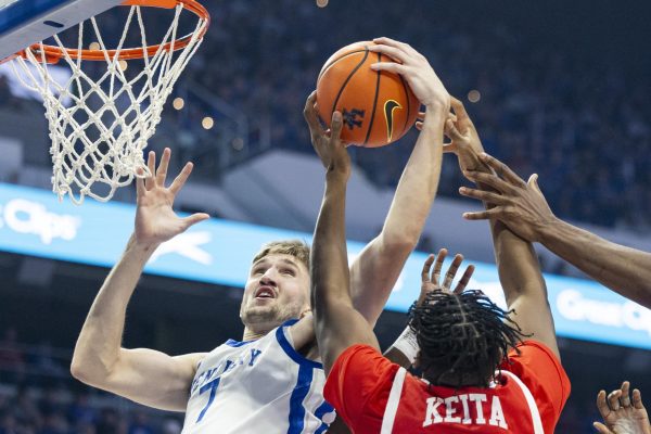 Kentucky Wildcats forward Andrew Carr (7) jumps to grab a rebound during the basketball game vs. WKU on Tuesday, Nov. 26, 2024, at Rupp Arena in Lexington, Kentucky. Photo by Matthew Mueller | Photo Editor