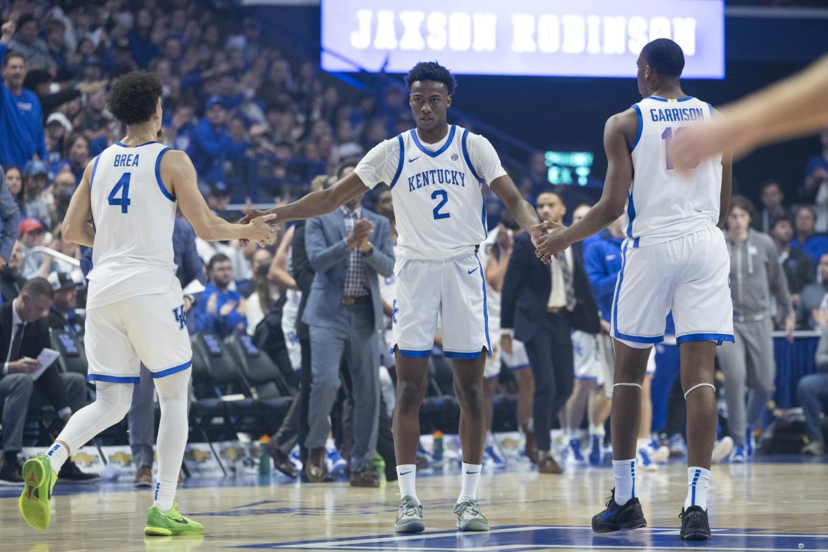 Kentucky Wildcats guard Jaxson Robinson (2) high-fives Kentucky Wildcats guard Koby Brea (4) and Kentucky Wildcats forward Brandon Garrison (10) after making a three-point shot during the basketball game vs. Lipscomb Tuesday, Nov. 19, 2024, at Rupp Arena in Lexington, Kentucky. Photo by Matthew Mueller | Photo Editor