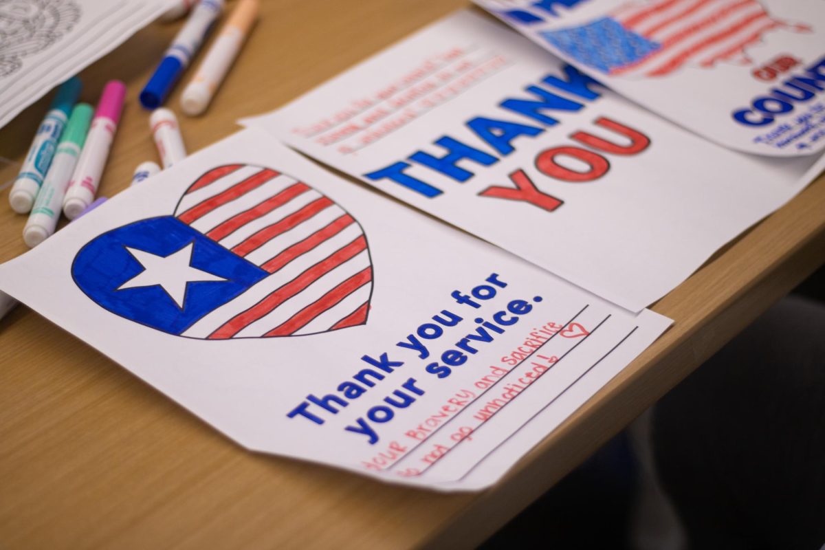 University of Kentucky student colors a Veteran’s Day card at the center for student involvement on November 11th 2024. Photo by Michael Henning | Staff