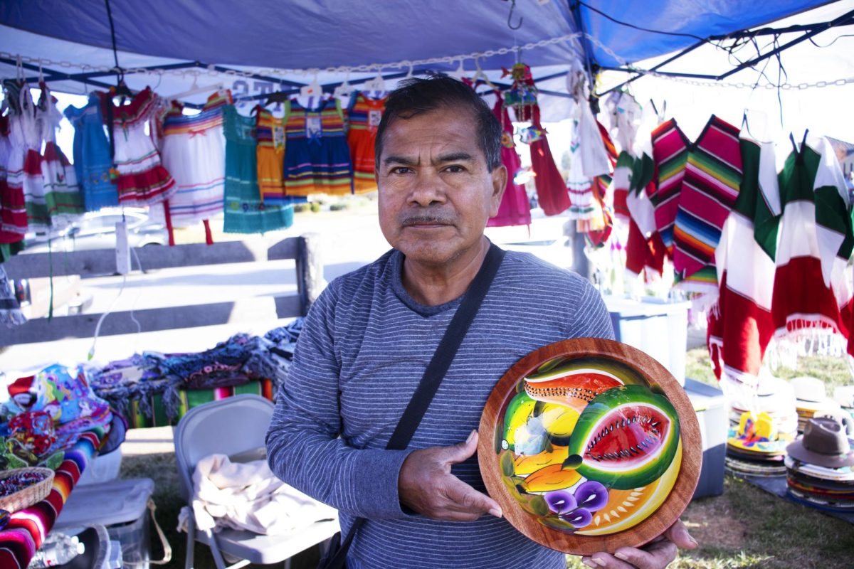 Jose Delacruz, also known as “Mr.Sombrero” for his business, Mr.Sombrero llc. holds a handmade bowl Nov. 2, 2024 at the Lexington Dia De Los Muertos Festival & The Moondance Amphitheater in Lexington, Kentucky.