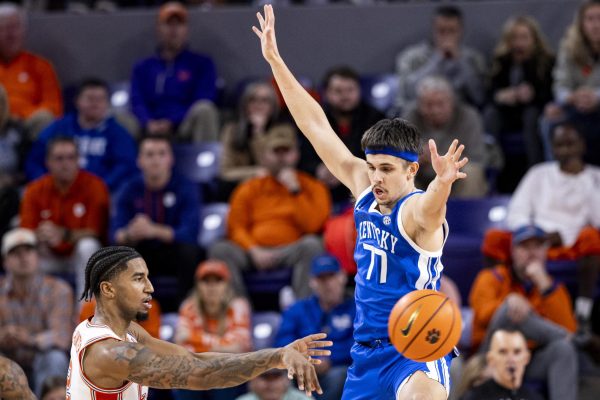 Kentucky Wildcats guard Kerr Kriisa (77) tries to disrupt Clemson Tigers guard Dillon Hunter (2) pass during the basketball game vs. Clemson on Tuesday, Dec. 3, 2024, at Littlejohn Coliseum in Clemson , South Carolina . Kentucky lost 70-66. Photo by Matthew Mueller | Photo Editor