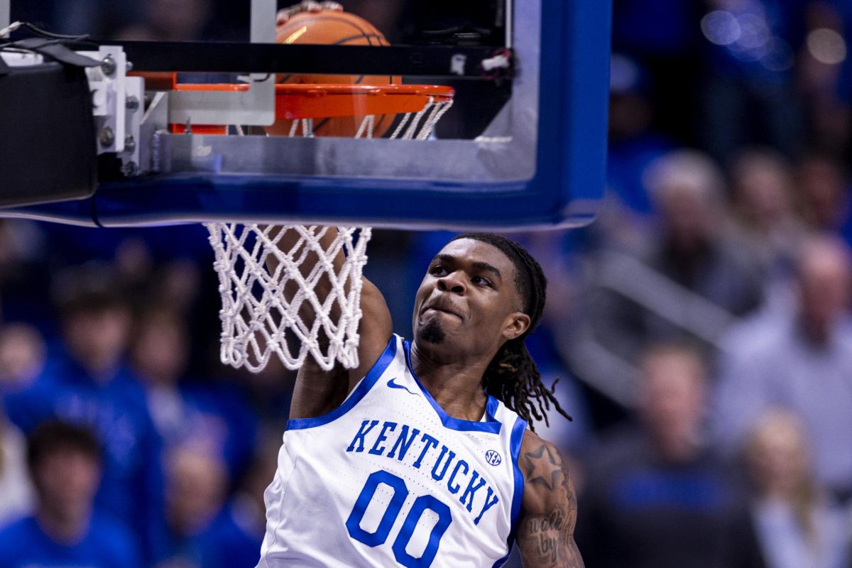 Kentucky Wildcats guard Otega Oweh (0) dunks the ball during the basketball game vs. Louisville on Saturday, Dec. 14, 2024, at Rupp Arena in Lexington, Kentucky. Kentucky 93-85. Photo by Matthew Mueller | Photo Editor