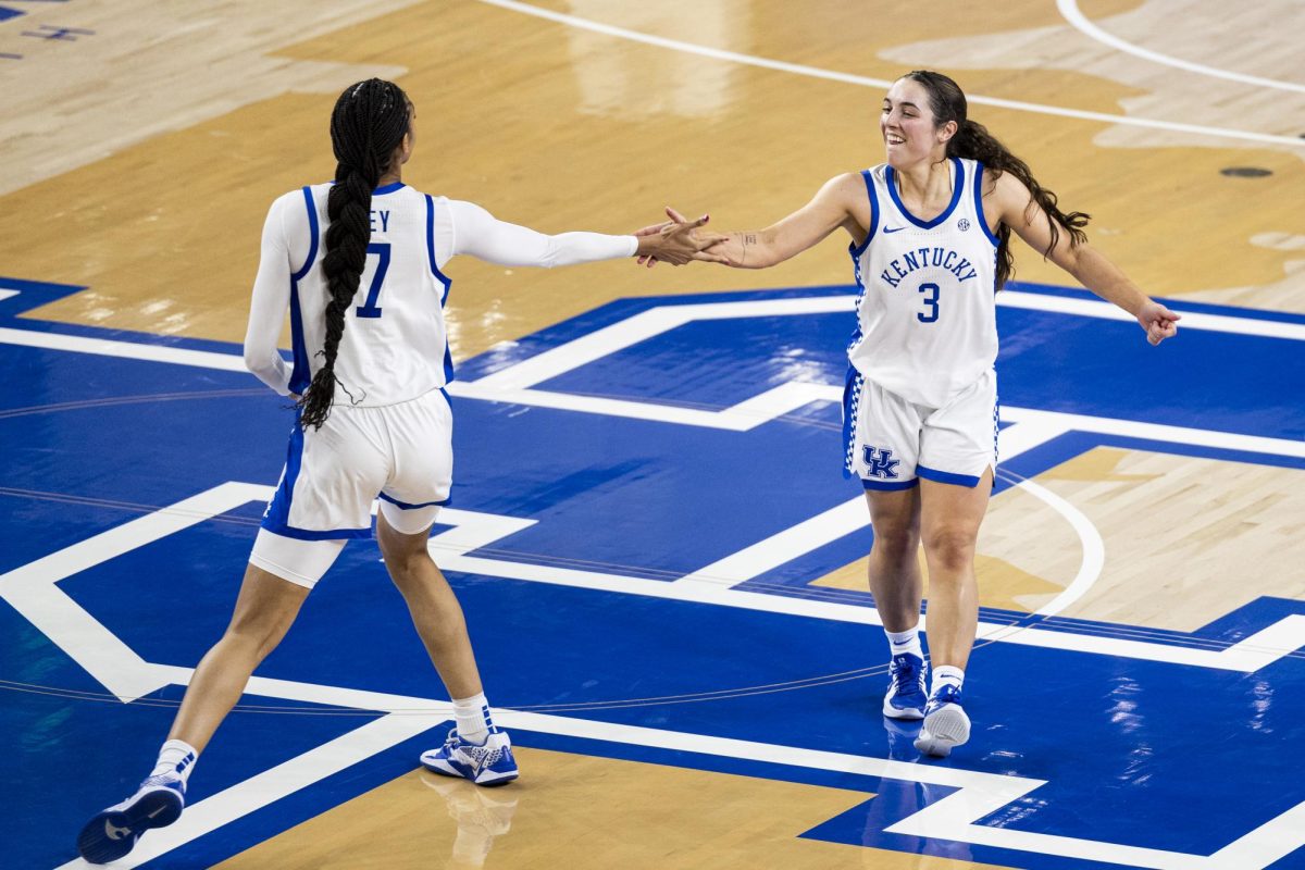 Kentucky Wildcats guard Georgia Amoore (3) and Kentucky Wildcats forward Teonni Key (7) high five while running back on defense during the basketball game vs. WUK on Saturday, Dec. 28, 2024, at Historic Memorial Coliseum in Lexington, Kentucky won 88-70 Photo by Matthew Mueller | Photo Editor