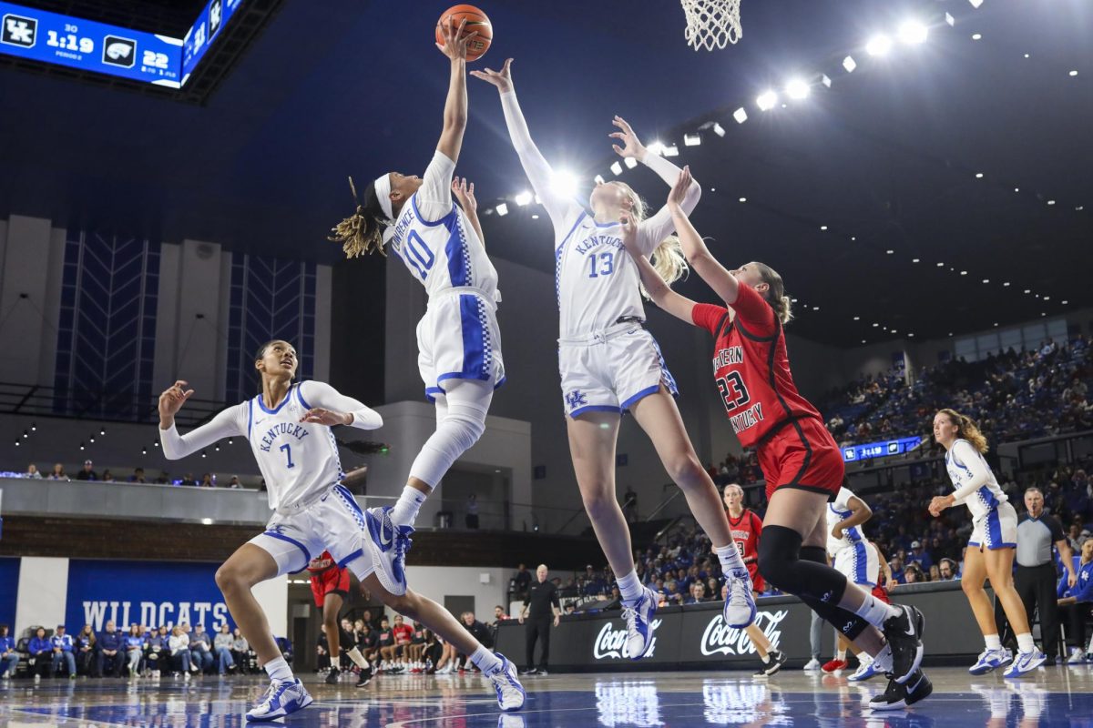 Kentucky Wildcats guard Dazia Lawrence (10) and Kentucky Wildcats center Clara Strack (13) jump for a rebound during the basketball game vs. WUK on Saturday, Dec. 28, 2024, at Historic Memorial Coliseum in Lexington, Kentucky won 88-70 Photo by Matthew Mueller | Photo Editor