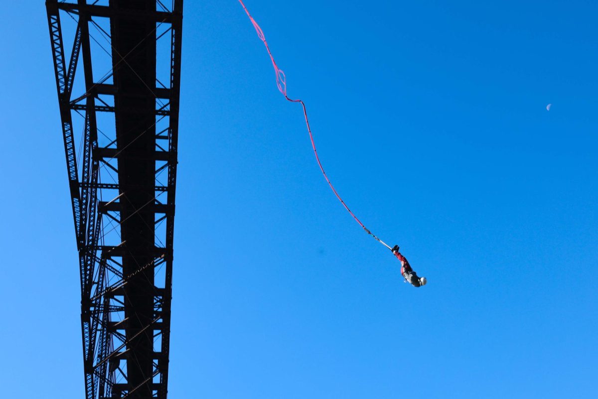 Doug Frutos takes the first jump of the day off the Young's High Bridge on Thursday, Oct. 24, 2024, in Lawrenceburg, Kentucky. Photo by Ava Bumgarner | Staff 