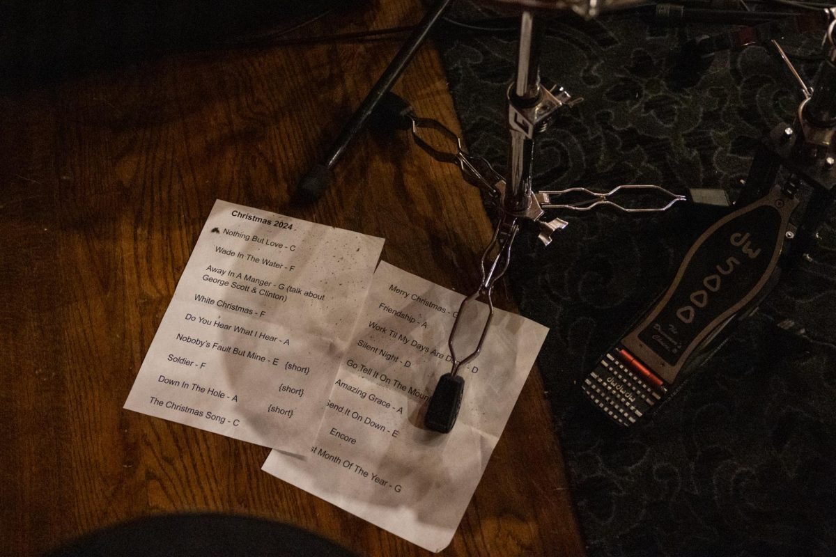 A set list sitting under a drum kit before the Troubadour Concert Series on Tuesday, Dec. 3, 2024, at Kentucky Theatre in Lexington, Kentucky. Photo by Sydney Yonker | Staff