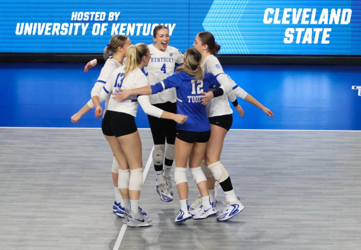 Kentucky wildcats celebrate after getting a vital point to send it to set point during the volleyball match vs. Cleveland state on Thursday, Dec, 5, 2024, at Historic Memorial Coliseum in Lexington, Kentucky. Kentucky won 3-0. Photo by Robby Robinson. | Staff