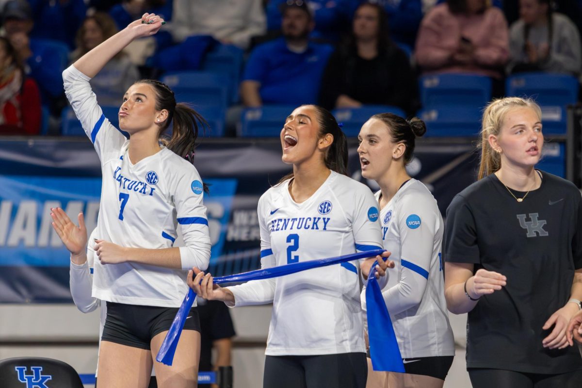 Kentucky Wildcats outside hitter Haley Melby (7) and setter Ava Sarafa (2) celebrate from the bench after a point during the Kentucky vs. Cleveland State volleyball game on Thursday, Dec. 5, 2024, at Historical Memorial Coliseum in Lexington, Kentucky. Kentucky won 3-0. Photo by Sydney Novack | Staff