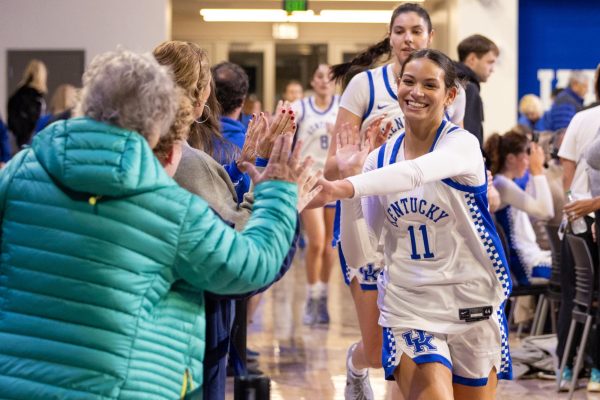 Kentucky Wildcats guard Gabby Brooks (11) high fives fans after the Kentucky vs. Queens women’s basketball on Monday, Dec. 9, 2024, at Historic Memorial Coliseum in Lexington, Kentucky. Kentucky won 87-45. Photo by Sydney Yonker | Staff