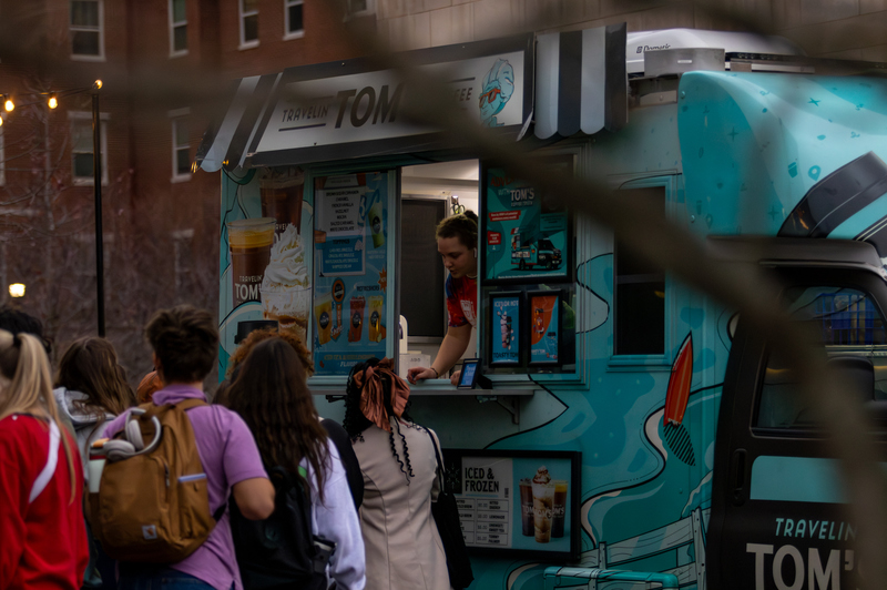 Students line up at Travelin' Tom's Coffee food truck during the Winter Frost event on Tuesday, Dec. 10, 2024, outside The 90 in Lexington, Kentucky. Photo by Sydney Novack | Staff